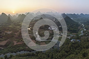 Aerial view of the karsts hills in Wuzhishan near Yangshuo in Guanxi province, China, at sunset