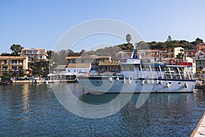 Aerial view of Kassiopi, village in northeast coast of Corfu island, Ionian Islands, Kerkyra, Greece in a summer sunny day, with