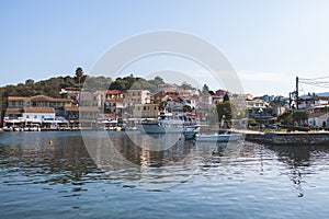 Aerial view of Kassiopi, village in northeast coast of Corfu island, Ionian Islands, Kerkyra, Greece in a summer sunny day, with