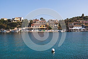 Aerial view of Kassiopi, village in northeast coast of Corfu island, Ionian Islands, Kerkyra, Greece in a summer sunny day, with