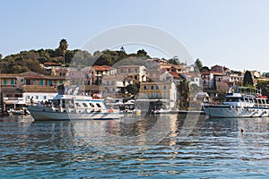 Aerial view of Kassiopi, village in northeast coast of Corfu island, Ionian Islands, Kerkyra, Greece in a summer sunny day, with