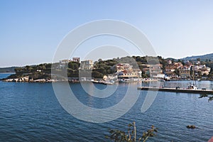 Aerial view of Kassiopi, village in northeast coast of Corfu island, Ionian Islands, Kerkyra, Greece in a summer sunny day, with