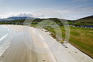 Aerial view on Keem beach and town. Warm sunny day. Cloudy sky. Popular area for tourists in West of Ireland. Beautiful nature