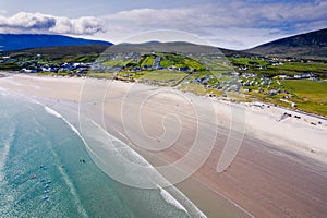 Aerial view on Keem beach and town. Warm sunny day. Cloudy sky. Popular area for tourists in West of Ireland. Beautiful nature