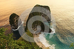 Aerial view Kelingking Beach at Sunset. Nusa Penida Island, Bali, Indonesia. Kelingking mean pinkie or little finger.