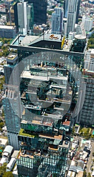 Aerial view of King Power Mahanakhon tower in Sathorn Silom central business district of Bangkok, Thailand