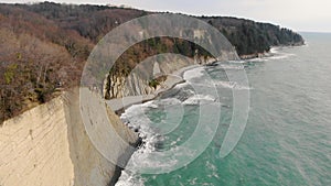 Aerial view of Kiseleva rock, Krasnodar Territory. People are standing on top of cliff. Rock consists of white slabs and