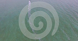 Aerial view kite surfing in tropical blue ocean 4K