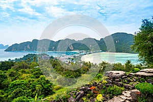 Aerial view of Ko Phi Phi islands, Thailand. Lookout from the viewpoint to tropical island, beach and ocean with long tail boats.