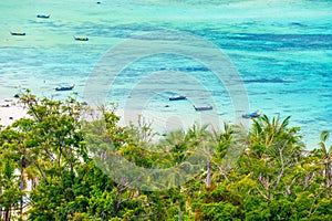 Aerial view of Ko Phi Phi islands, Thailand. Lookout from the viewpoint to tropical island, beach and ocean with long tail boats.