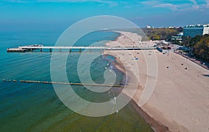 Aerial view on Kolobrzeg city, area of pier and beach at baltic sea shore
