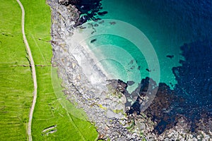 Aerial view of Koltur island in Faroe Islands, North Atlantic Ocean. Photo made by drone from above. Nordic Natural Landscape