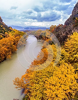 Aerial view of Konitsa old bridge and Aoos River an autumn day,