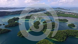 Aerial View Of Koror Island. Many Green Islets. Palau Seascape With Colorful Coral Reefs And Tropical Lagoons. Cityscape in