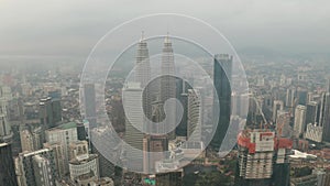 Aerial view of Kuala Lumpur city skyline during cloudy day