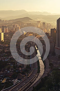 Aerial view of Kuala Lumpur Downtown with hills, Malaysia and highways road. Financial district and business centers in smart