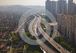 Aerial view of Kuala Lumpur Downtown, Malaysia and highways road. Financial district and business centers in smart urban city in