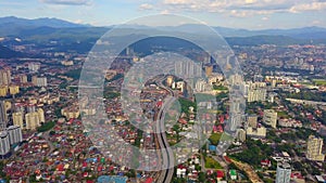 Aerial view of Kuala Lumpur Downtown, Malaysia and highways road. Financial district and business centers in smart urban city in