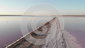 Aerial view of Kuyalnik Estuary with salt and old wooden piles on sunny day and good weather. View of estuary columns, salty sands