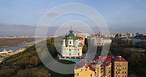 Aerial view Kyiv St. Andrews Church at sunset. Drone flies over old Kiev