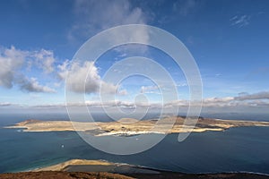 Aerial view of La Graciosa Island from Lanzarote against a dramatic sky, Canary Islands, Spain