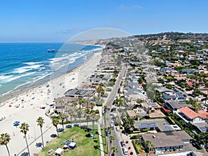 Aerial view of La Jolla bay with nice small waves and tourist enjoying the beach and summer day