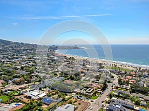Aerial view of La Jolla coastline with nice small waves and beautiful villas.
