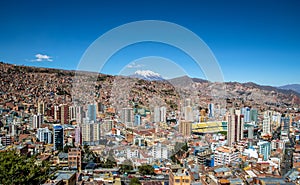 Aerial view of La Paz city with Illimani Mountain on background - La Paz, Bolivia photo