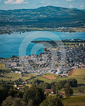 Aerial view of Lachen panorama and lake Zurich,Switzerland,and a forested mountain in the background