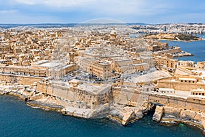 Aerial view of Lady of Mount Carmel church, St.Paul`s Cathedral and a great bay with a cruise liner ship in Valletta city, Malta