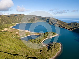 Aerial view of Lagoa do Fogo, a volcanic lake in Sao Miguel, Azores Islands. Portugal landscape taken by drone. Amazing tourist a