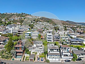 Aerial view of Laguna Beach coastline town with houses on the hills, California