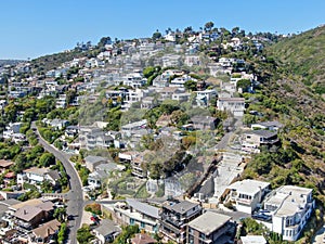 Aerial view of Laguna Beach coastline town with houses on the hills, California