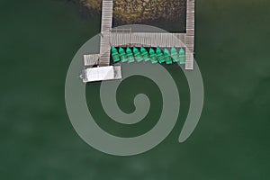 Aerial view of a lake boat dock. Flying above a vessel pier