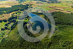 Aerial view of a lake in the forests of Lithuania, wild nature