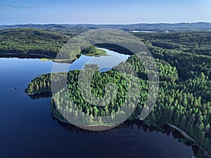 Aerial view of lake, islands, and forest.