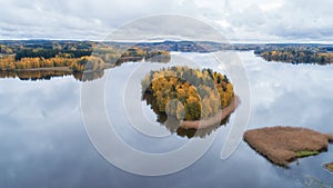 Aerial view of a lake with islands in the middle of the forest