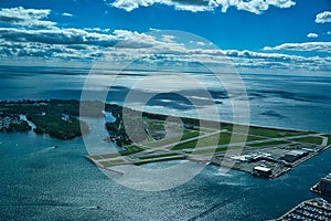 Aerial view of Lake Ontario with a view of a small airport and runway in Toronto, Canada