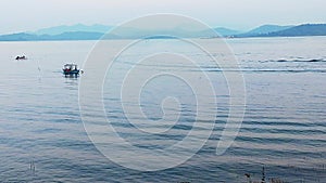 Aerial view of Lake Patratu in Jharkhand India in summer, people in boats floating on the surface of Lake water.