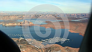 Aerial View of the Lake Powell with the house-boats marina and buttes on the shores