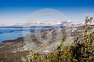 Aerial view of Lake Tahoe` shoreline on a sunny winter day, Sierra mountains, Nevada