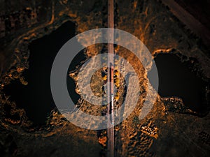 Aerial view of lakes near train track