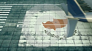 Aerial view of a landing airplane and flag of Cyprus on the airfield of an airport. Air travel related conceptual 3D