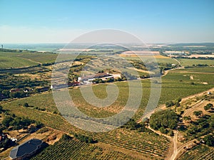 Aerial view of landscape with fields and buildings