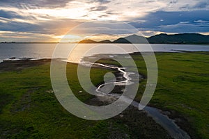 Aerial view landscape nature Water flow to river and grass background at sunset. copy space.