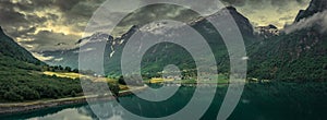 Aerial view of landscape panorama of fjord at Briksdalsbreen glacier in Jostedalsbreen mountains during summer sunset