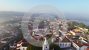 Aerial view landscape with picturesque town Obidos in foggy morning