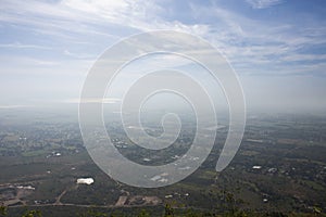 Aerial view landscape and rice field or paddy land from Khao Phraya Doen Thong viewpoint with valley village hill and clouds sky