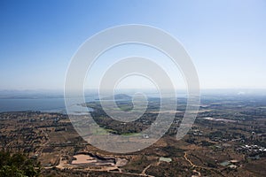 Aerial view landscape and rice field or paddy land from Khao Phraya Doen Thong viewpoint with valley village hill for thai people