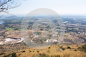 Aerial view landscape and rice field or paddy land from Khao Phraya Doen Thong viewpoint with valley village hill for thai people
